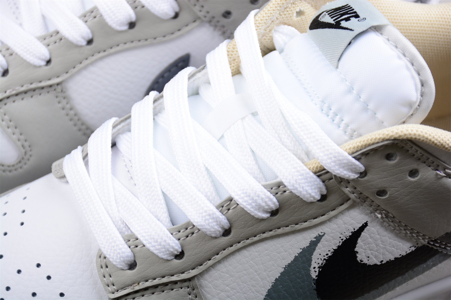 Nike Dunk Low "Spray Paint" Swoosh Gray